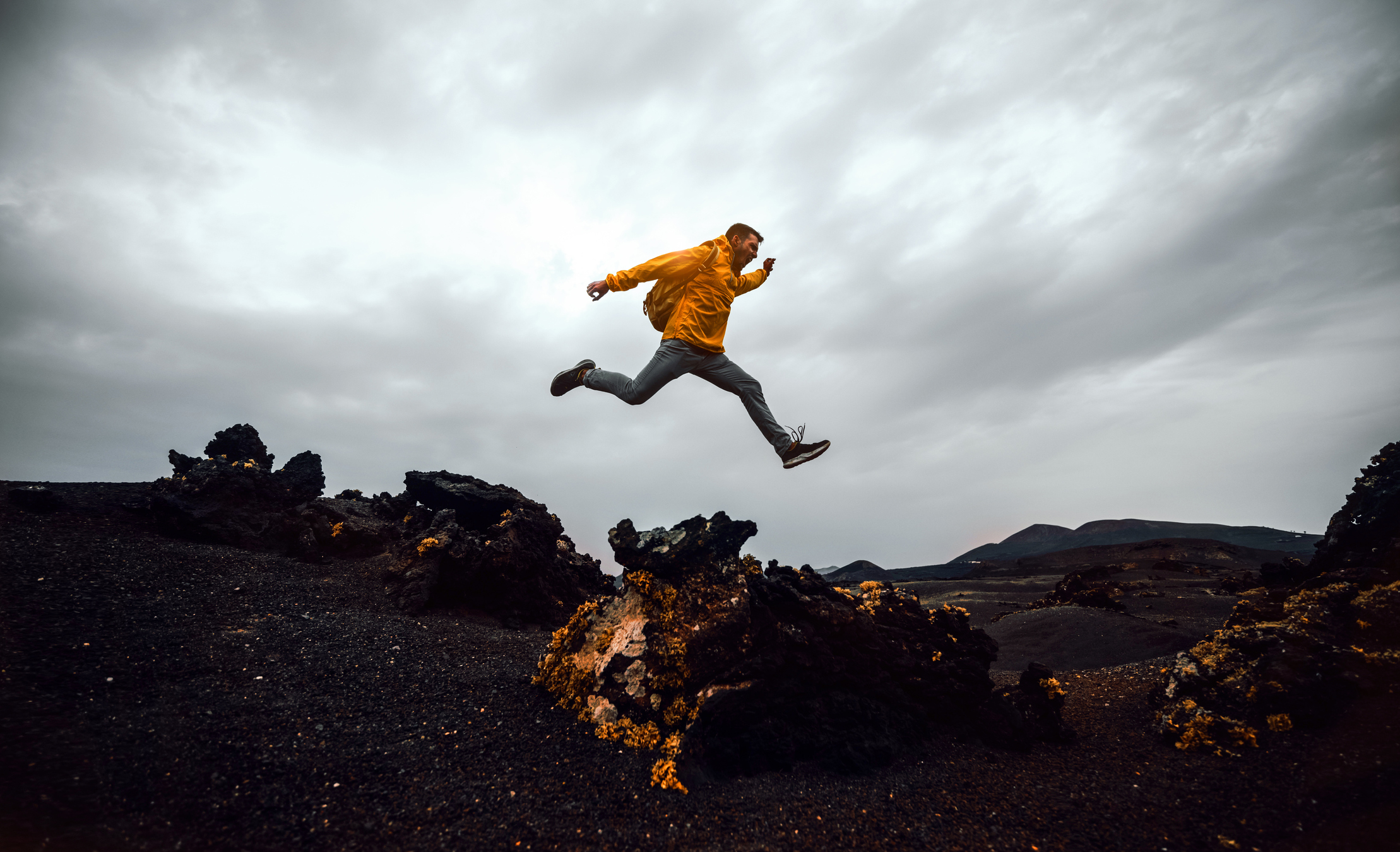 Man jumping over the mountain